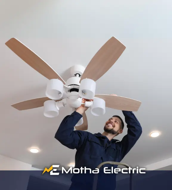 Motha Electrician working on a ceiling fan installation in Middlesex County, MA.