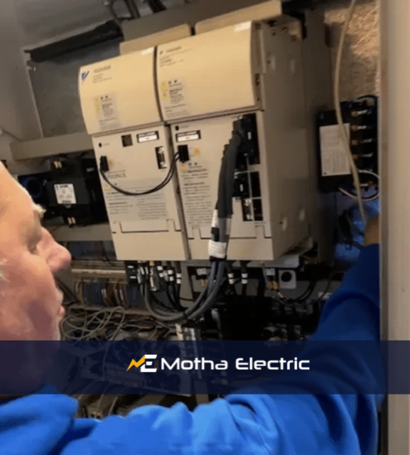 Motha Electric technician performing an electrical installation, ensuring safety and quality.